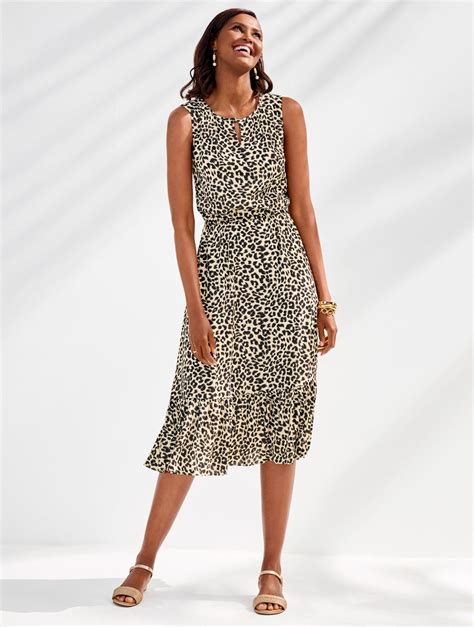 Our Fun And Fashionable Animal Print Dress In A Midi Length With A