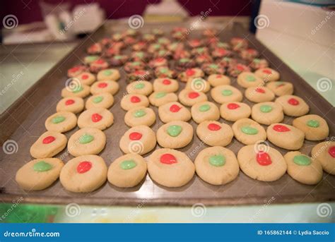 Sheet Pan Of Round Christmas Cookies With Red And Green Icing Stock