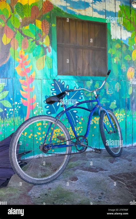 Bicycle And Decorated Wall Of A Home In The Coastal Town Of Puerto