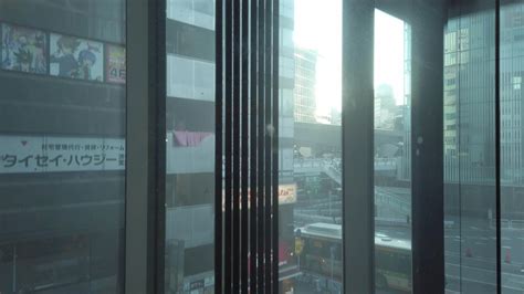 inside moving up down elevator lift in major department store in Tokyo