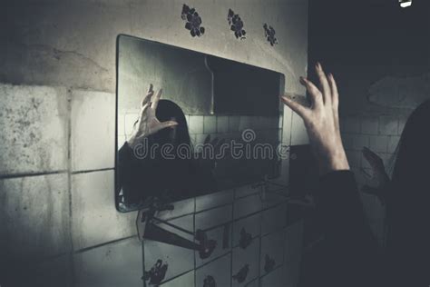 Horror Movie Scene With A Creepy Face In The Mirror Stock Photo Image