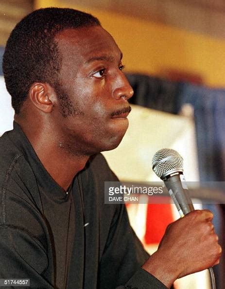 US sprinter Michael Johnson talks to reporters after he lost the ...