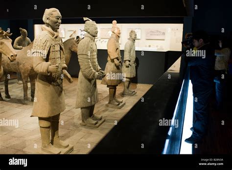 Tourist Photographs Terracotta Warriors On Display In The Shaanxi