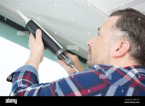 Using a sealant gun hi-res stock photography and images - Alamy