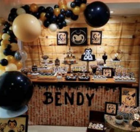 An Assortment Of Desserts And Balloons On Display In Front Of A Wooden