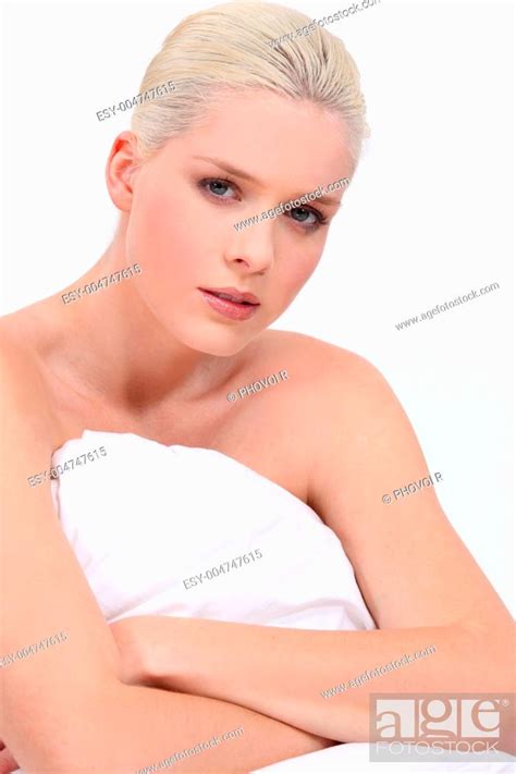 Blonde Woman Naked Sitting On Bed With A Neutral Face Expression Stock Photo Picture And Low