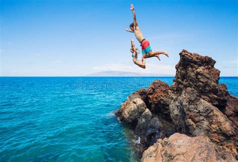 Summer Fun Cliff Jumping Stock Photo Image Of Friends 63028280