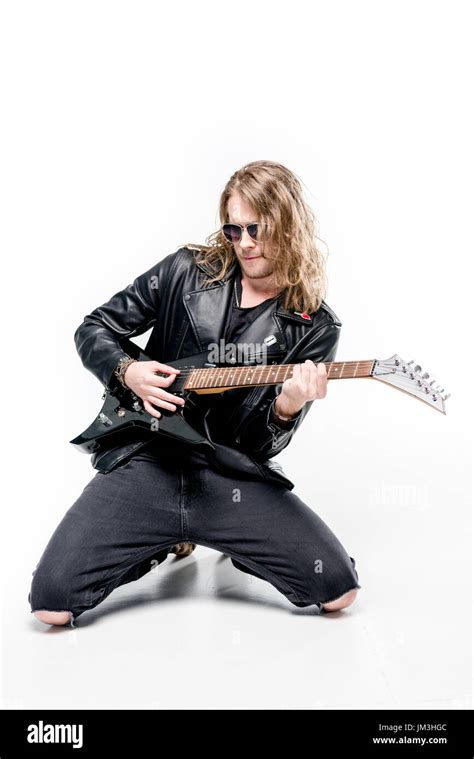 Handsome Rocker In Sunglasses Posing Playing Electric Guitar Isolated