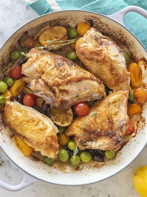 Chicken And Vegetables In A Skillet With Lemons Olives And Tomatoes