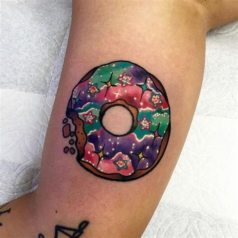 A Colorful Donut Tattoo On The Leg