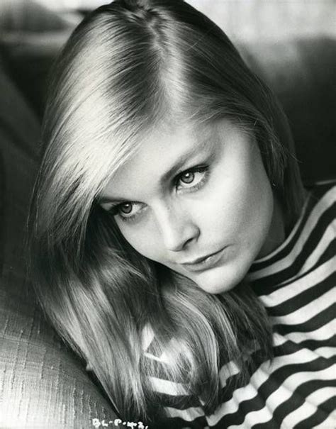 Black And White Photograph Of A Woman With Long Blonde Hair Wearing