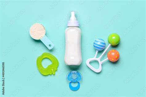 Bottle Of Baby Milk Formula And Accessories On Color Background Stock