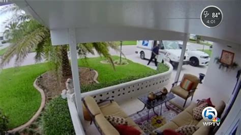 Camera Catches Postal Worker Throwing Package