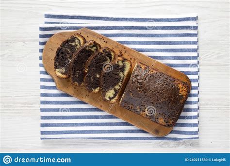 Homemade Chocolate And Vanilla Marble Cake On A Rustic Wooden Board Top View Flat Lay