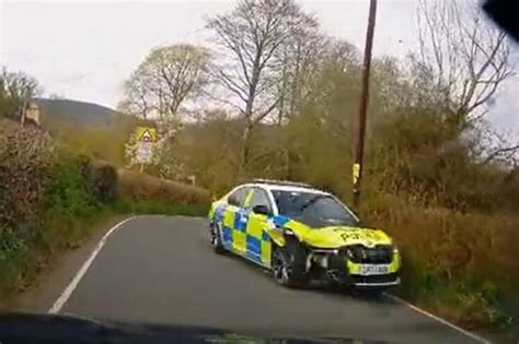 Dashcam Footage Captures Moment Police Car Leaves Road And Crashes Into