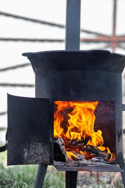 Premium Photo Cooking Food Or Pilaf In A Cauldron On Fire Cooking In