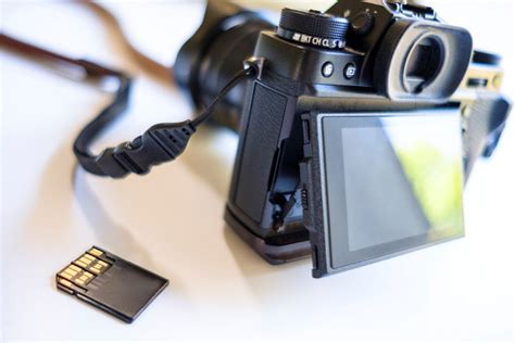 Memory card with digital camera on white - StockFreedom - Premium Stock ...