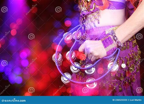 Belly Dancer Wearing Purple Dance Costume Close Up With Bokeh Stock