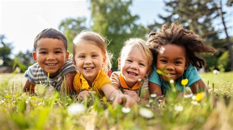 premium photo children laying   grass smiling  laughing