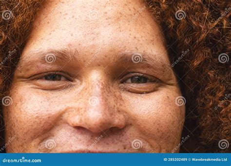 Portrait Close Up Of Happy Biracial Man With Red Curly Hair And