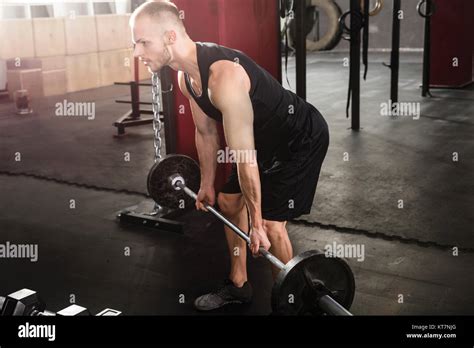 Man Lifting Barbell Stock Photo Alamy