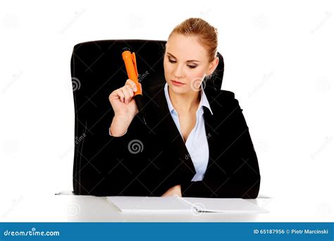 Pensive Business Woman Making Notes With A Huge Pen Stock Photo Image