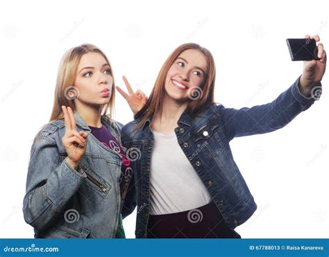 Two Young Women Taking Selfie With Mobile Phone Stock Image Image Of