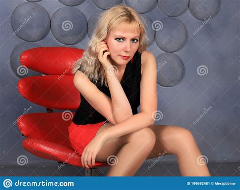 Blonde Model In Stockings And Red Miniskirt Posing In Studio Stock Image Image Of Highheels
