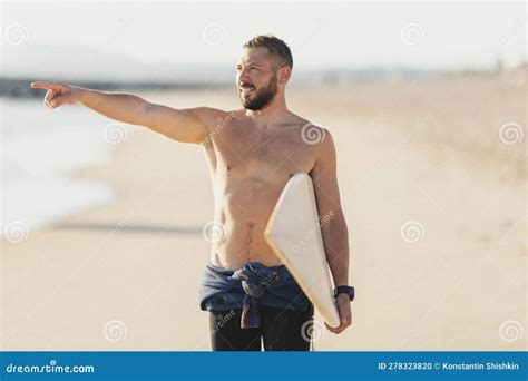 A Man Surfer With Naked Torso Pointing At The Sea Stock Photo Image Of Surfer Motivation