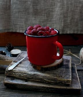 Premium Photo | Berry raspberry red mug tree rustic