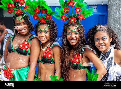 Girls in matching festive costumes at a carnival block party in the ...