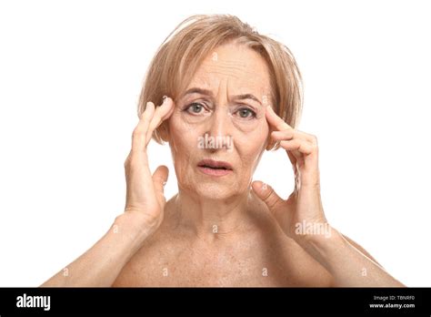 Beautiful Mature Woman Suffering From Head Ache Against White Background Stock Photo Alamy
