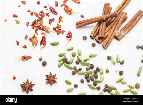 Cardamom Seeds Among Allspice Star Anise And Dry Red Pepper Pods On