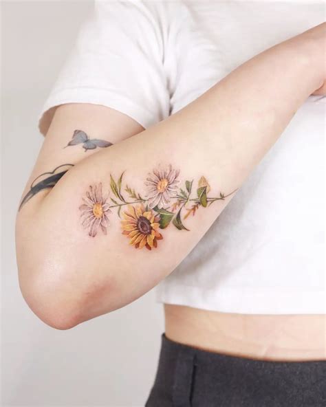 Daisy Wrist Tattoo