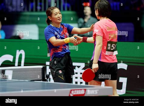 Liu Shiwen Of China Shakes Hands With Chen Meng Of China After Their