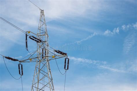 High Voltage Electric Pole With Wires On Blue Sky Background Line Of