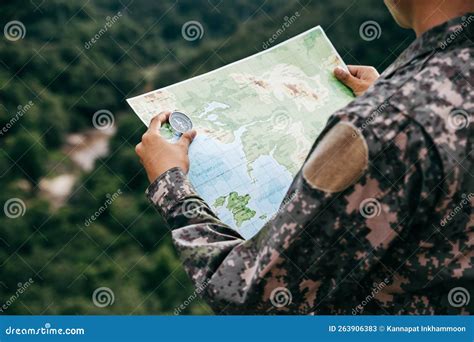 Soldiers Holding Compass And Map For Determines The Location Stock