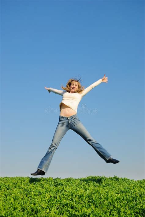 Happily Jumping Fit Attractive Woman Stock Photo Image Of