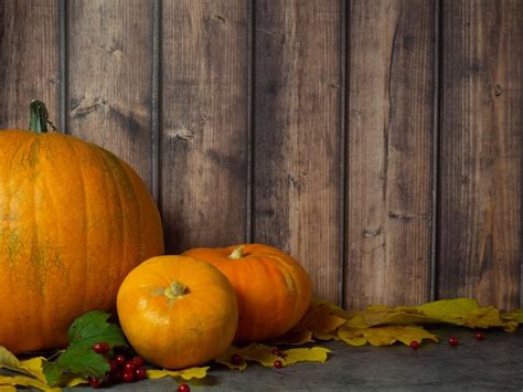 Premium Photo | Autumn halloween pumpkins on wooden background