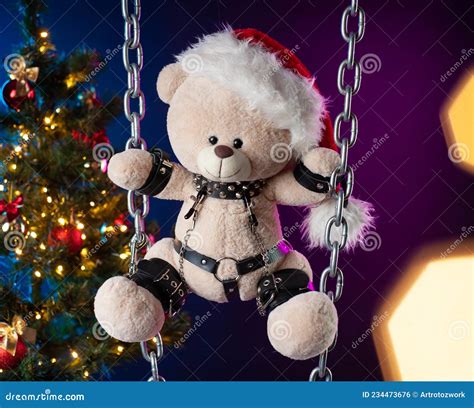 A Teddy Bear In A Santa Claus Hat Is A Christmas Gift For BDSM Games On