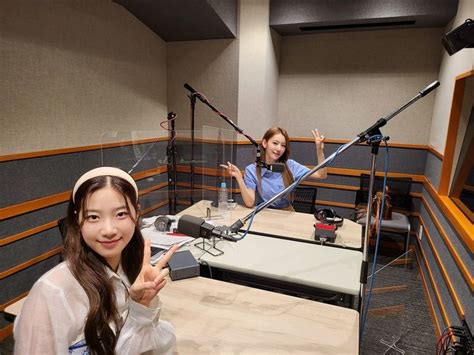 Two Girls In A Recording Studio With Microphones And Sound Equipment On