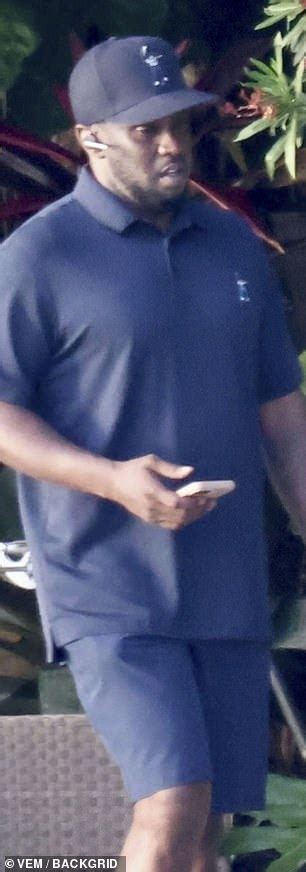 Diddy Takes A Call At His Miami Mansion After Double Raids On His Homes Amid Sex Trafficking