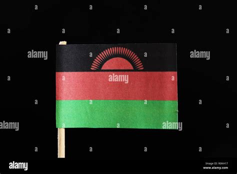 A Original Flag Of Malawi On Toothpick On Black Background Consists Of