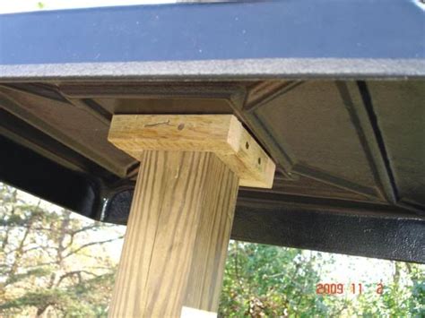 How squirrel baffle is mounted to post Bird House Feeder, Tea Cup Bird