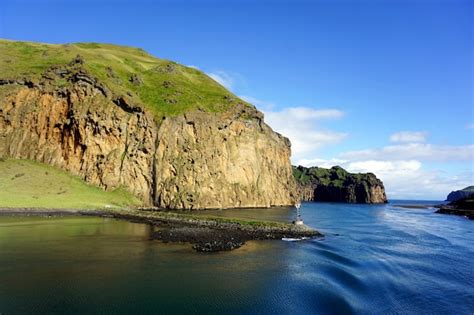 Premium Photo Westman Islands Vestmannaeyjar In Summer Green Grass