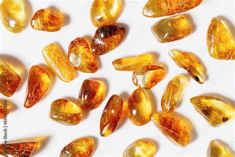 Natural gemstones of amber as background, transparent stones yellow orange colors. Natural ...