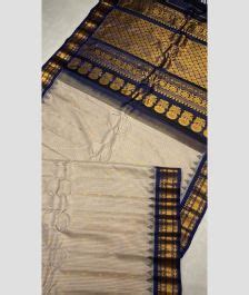 Cream And Navy Blue Color Gadwal Pattu Handloom Saree With All Over