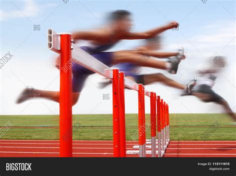 Hurdle Race Men Jumping Over Image And Photo Bigstock