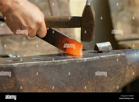 To Strike While The Iron Is Hot Stock Photo Alamy