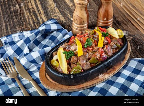 Roast Meat Sauteed With Vegetables On Wooden Background Saute Meat In